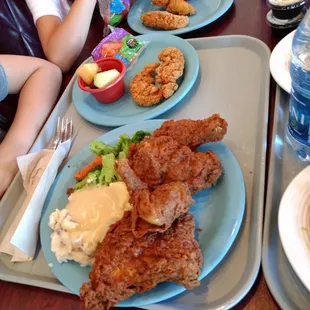 fried chicken with mash potatoes and gravy, with a side of steamed veggies.  not a bad lunch if you don't eat all the slightly salty batter