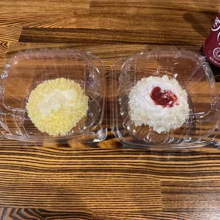 two cupcakes in plastic containers