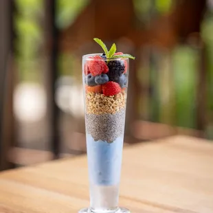 a glass of fruit and yogurt