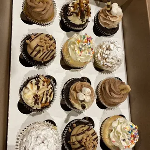 Assortment of delicious Flour &amp; Sugar Cakery cupcakes