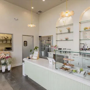 a bakery counter with a variety of pastries