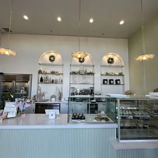 a bakery counter with a variety of baked goods