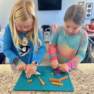 "cutting up" at cooking camp!