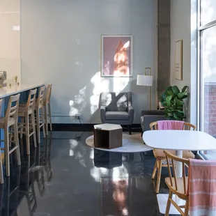 a bar with chairs and a table