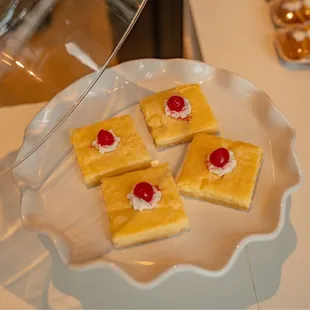 a plate of desserts on a table