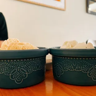 two bowls of food on a table