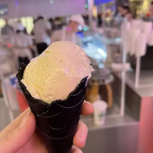 Vanilla bean ice cream in midnight vanilla cone