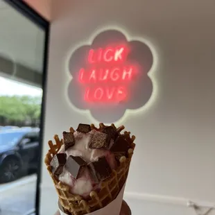 Raspberry Tres Leches Single Scoop in a normal Waffle Cone.