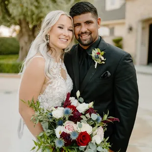 Gorgeous bride with her bridal bouquet along with groom and his boutonniere