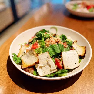  a bowl of salad on a table
