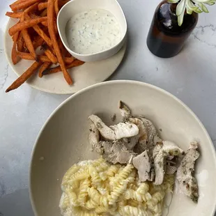 Chicken entree plate with Gluten-Free Mac &amp; Cheese and Roasted Sweet Potato Fries