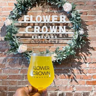 a hand holding a glass