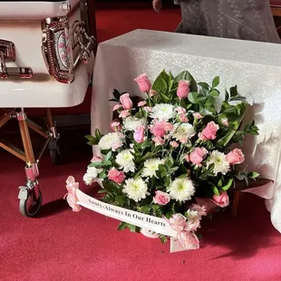 A modified "Sweet Mum" arrangement including pink roses and carnations.