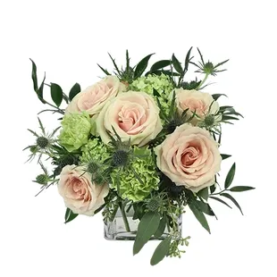 This stunning bouquet is perfect for those who desire a softer look. Featuring green carnations, pale pink roses, blue thistles, ...