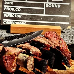 Savage and fantastically delish BBQ short ribs  created on a rustic grill - experience the magic of short rib BBQ heaven!
