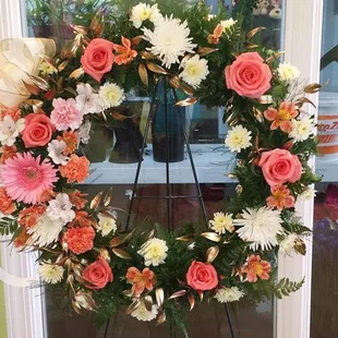 Pink and white bridal shower wreath.