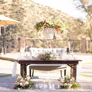 This sweetheart table makes my heart so happy!  Flowers and arch by Flowers by Mae Mae  Chandelier and decor by The Olivine Collective