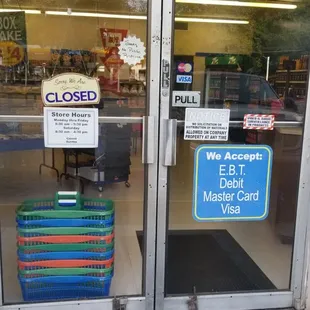 a closed door and a closed sign