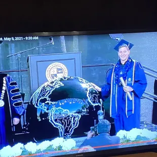 Josh wearing his blue and gold themed CBU lei for his graduation 2021!