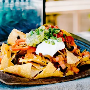 a plate of nachos with sour sour sour sour sour sour sour sour sour sour sour sour sour sour sour