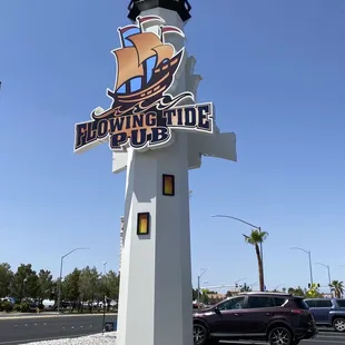 the sign for flowing tide pub