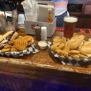 Brisket sandwich with waffle fries and turkey special with onion chips.