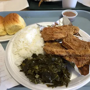 This is the pork chops, greens, rice and graveyard. Perfect in every way. Not to greasy or salty. I'm coming back.