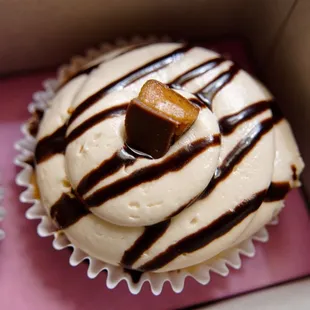a cupcake with chocolate and caramel