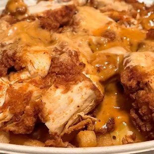 Fluffies Filled Fries. With 1/2 Mac. Hot chicken &amp; sauce over fries and macaroni and cheese