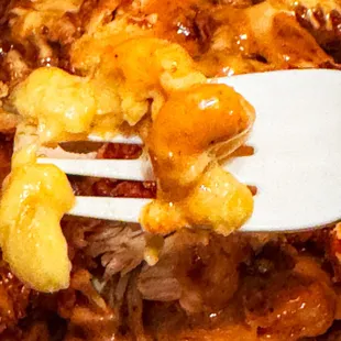 Fluffies Filled Fries 1/2 mac&amp;cheese. Half French fries + half macaroni &amp; cheese topped with fried chicken and sauce