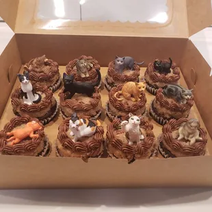 I added tiny cat figurines on top of each one. (I should have waited for the frosting to warm up to room temperature first).