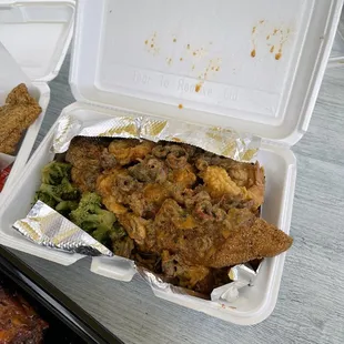 a meal in a styrofoam container