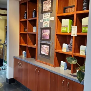 the counter and shelves of a coffee shop