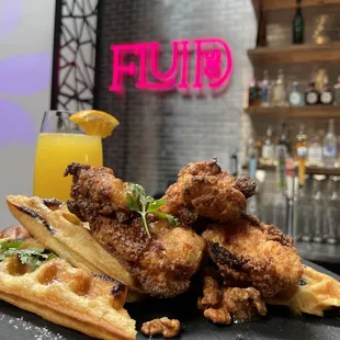 a pile of fried chicken and waffles
