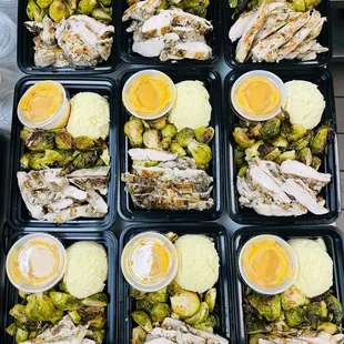a tray of chicken and brussel sprouts