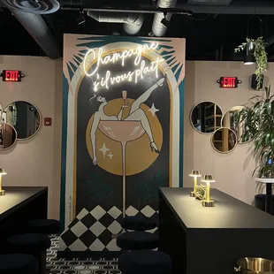 a woman in a bikini sitting on a stool