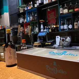 a bottle of beer on a bar counter