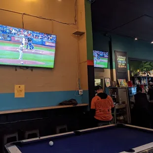 a baseball game being played on a flat screen tv