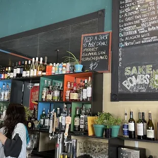 a woman standing at the bar
