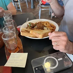 Beer flight, pasta with meatballs.
