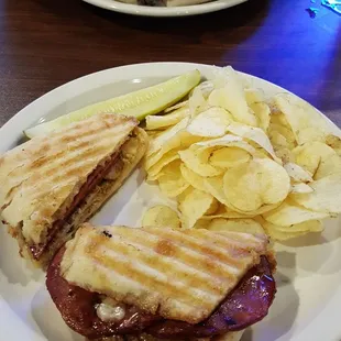 a sandwich and chips on a plate
