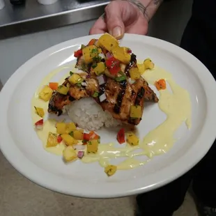 a person holding a plate of food