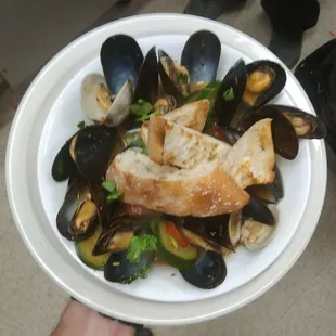 a plate of musselling and bread