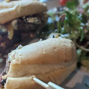 Steak sandwich with a side salad