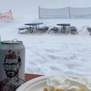 a plate of waffles and a can of beer