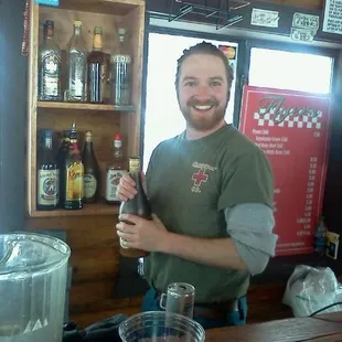 a man standing at a bar