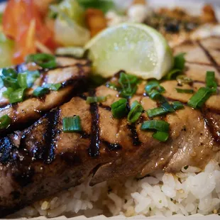 Grilled ahi w/ shoyu butter (fries, tossed salad included w/ plate) $16 as of Jan 2023