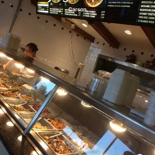 a man serving food in a restaurant