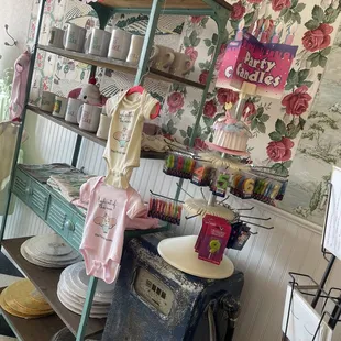 a display of cupcakes and cakes