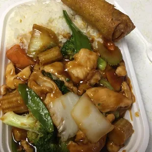 Chicken and vegetables with white rice and an egg roll